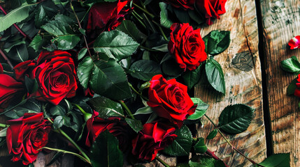 bouquet of red roses on wooden background