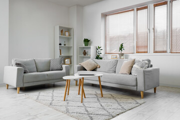 Stylish interior of living room with sofa and coffee table