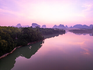 Aerial view Beautiful landscape nature view sunrise morning with reflections light over water surface during sunrise or sunset scenery mountains background
