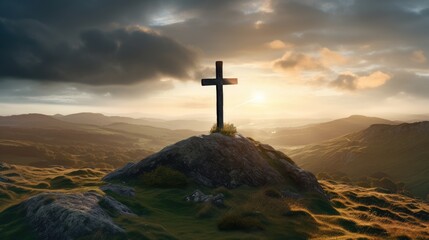 Dramatic sunset over a cross on a hilltop