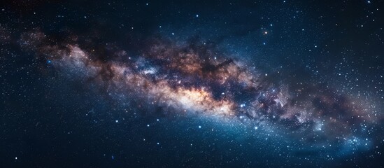 Capturing a detailed view of a vast galaxy, filled with numerous sparkling stars, set against a deep and dark night sky