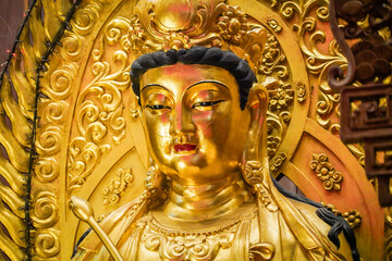 the guan yin statue in the temple with dramatic tone