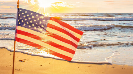 American flag on beach at sunset
