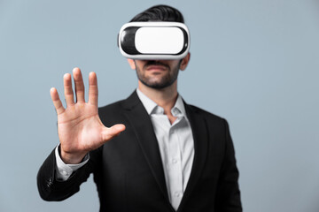 Professional smart business man holding something while wearing VR glasses. Caucasian project...