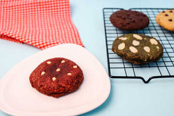 Red Velvet Cookie on Plate with Various Cookied Served on Cooling Rack 