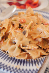  homemade cooked pasta in a plate on table .