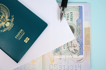 Passport with Pen and Stamped Visa to Travel Around The World 