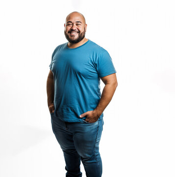 30s plus size latino man, standing and wearing a blue t-shirt, isolated on white 
