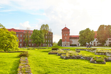 The courtyard is buried in flowers and greenery in the ancient Zamek Krolewski na Wawelu Castle in the center of Krakow.