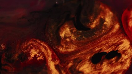 Glitter fluid. Ink oil bubbles. Blur red golden black sparkling paint water blob floating swirl smoke texture abstract art background.