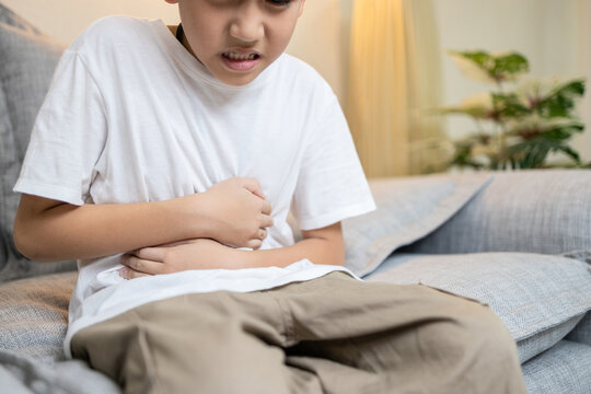 Child boy have flatulence,colic,indigestion,severe pain in abdomen caused by intestinal gas or obstruction in intestines,abdominal discomfort,Dyspepsia,difficulty in digesting food,digestive disorders