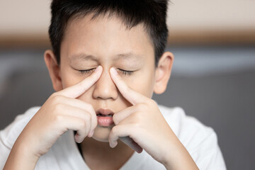 Child boy suffering chronic Rhinosinusitis,Rhinitis or acute Sinusitis,pain in nasal cavity,nose...