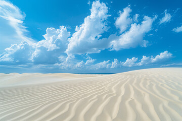 Expansive sandy desert under a bright blue sky with fluffy clouds, illustrating the vast, untouched beauty of natural landscapes