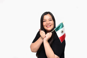 40-year-old Latina woman shows her thumb inked with indelible ink after voting freely and secretly in the electoral box