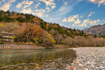Nature landscape at Kamikochi Japan, autumn foliage season with pond and mountain
