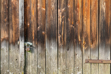 Aged wooden wall with iron lock background