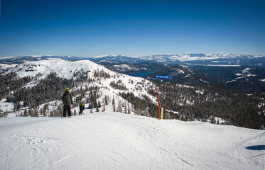 Unidentifiable skiiers head down Mt. Lincoln to the Lake View intermediate run at Sugar Bowl Ski...