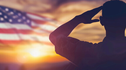silhouette of soldier saluting American flag at sunset