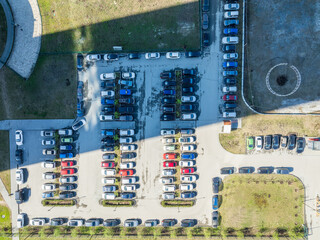 Open air big parking for residents of the area, top aerial view from high.