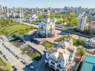 Obraz premium Summer Yekaterinburg, Temple on Blood and Church of St Nicholas in sunset. Aerial view of Yekaterinburg, Russia. Translation of text on the temple: Honest to the Lord is the death of His saints