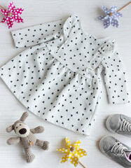 Baby dress for little girl, shoes, knitted toy and accessories.