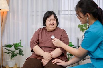 A young Asian female nurse or medical assistant uses a stethoscope to perform a physical...