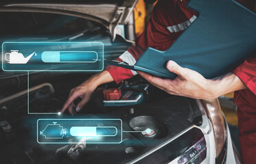 Car mechanic inspects car using technology and computer show resault at virtual screen.