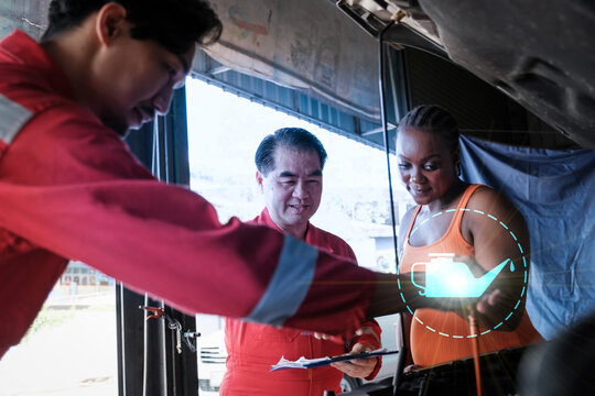 Car mechanic inspects car using technology and computer show resault at virtual screen.