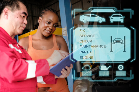 Car mechanic inspects car using technology and computer show resault at virtual screen.