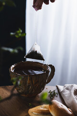 tea in a mug, dripping from a tea bag