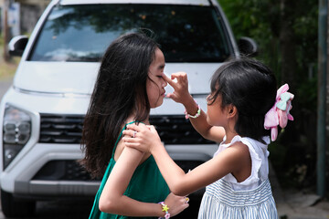 A little girl shows her concern for her cousin