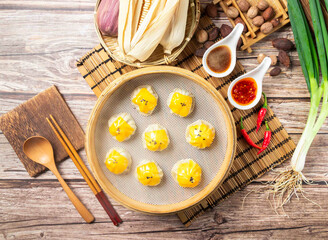 Cheese soup dumplings with chilli sauce, red pepper, spring onion served in dish isolated on mat...