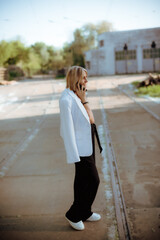 woman walking on the street
woman talking on the phone
person working on laptop Young woman with laptop walking outdoors in business district