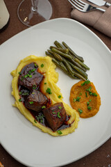 baked horse meat with demi-glace sauce, mashed potatoes and new beans