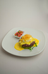 Beef steak with tender mousse on a gray background