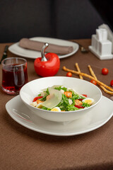 Caesar salad with salmon, parmesan and quail eggs
