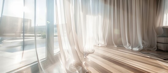 Interior design featuring a white curtain hanging on a glass window.