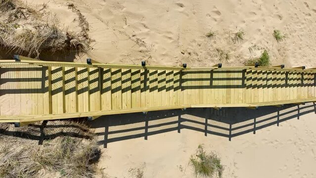 Aerial view, rising from above the staircase.