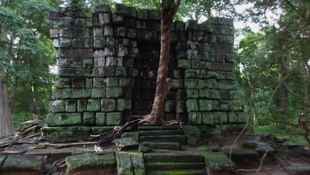 Camera pulls in to stone Prasat Linga at Koh Ker temple in Cambodia