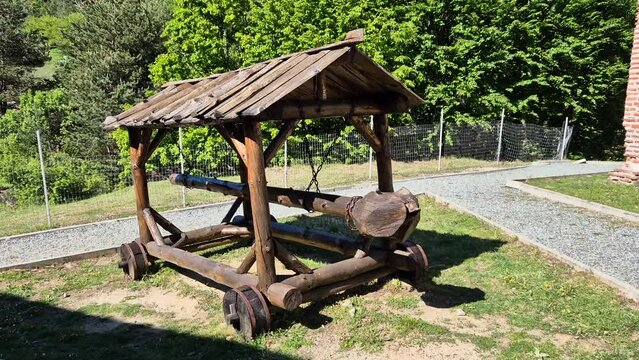 Medieval wooden battering ram. Reconstructed ancient weapon. Front view.