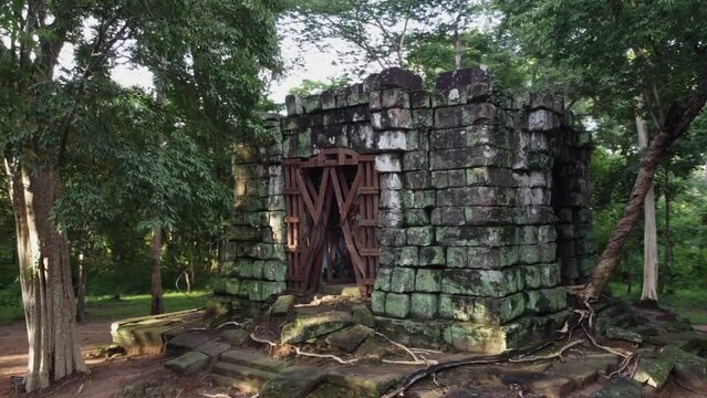 Camera orbits ancient Prasat Linga One at Koh Ker temple in Cambodia