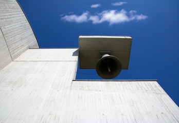 Modern church architecture with bronze bel