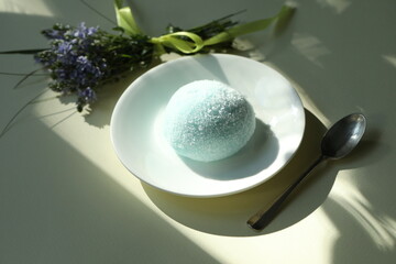 Colorful japanese daifuku mochi sweets with flower decoration