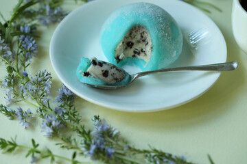 Colorful japanese daifuku mochi sweets with flower decoration
