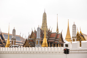 Naklejka premium group of ornate spires in national palace in center of Bangkok Thailand