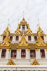 golden stupa spires on buddhist temple in Bangkok Thailand