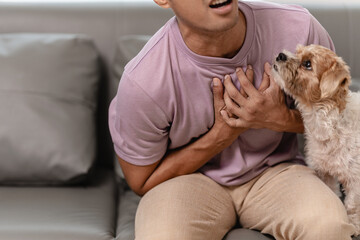Man touching heart with heart disease concept suffering Contractions and difficulty breathing Chest pain or heart attack, life insurance, health care concept