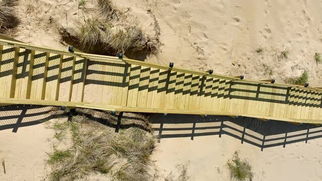 Touring a pass through the stairs on the dunes.
