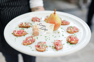 Gourmet tartare canapés on display at a luxury event