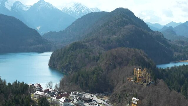 Scenic view of Hohenschwangau Castle, Alpsee lake and mountains in Germany
